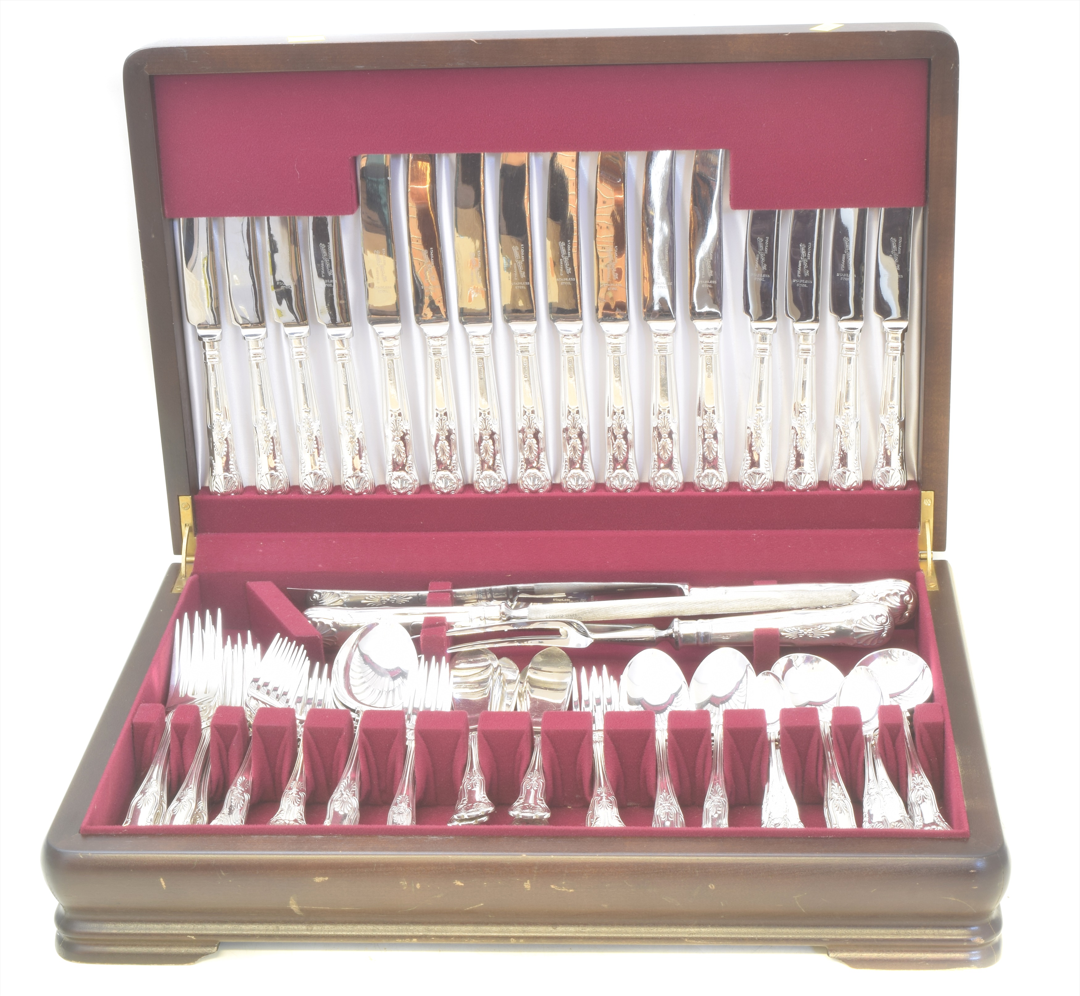 An Elizabeth II 97 piece canteen of silver and silver handled 'King's pattern' cutlery, comprising eight silver dinner forks, eight silver fish forks, four silver table spoons, eight silver dessert forks, eight silver fish knives, eight silver dessert spoons, eight silver boiled egg spoons, eight silver soup spoons, eight silver teaspoons, eight silver handled table knives, eight silver handled dessert knives, two silver handled meat skewers and one silver handled carving knife, together with two additional silver handled dessert knives and eight silver handled butter knives in a mahogany veneered canteen, hallmarks for Pinder Brothers, Sheffield, 1977, gross weight of solid silver items 126.13ozt.