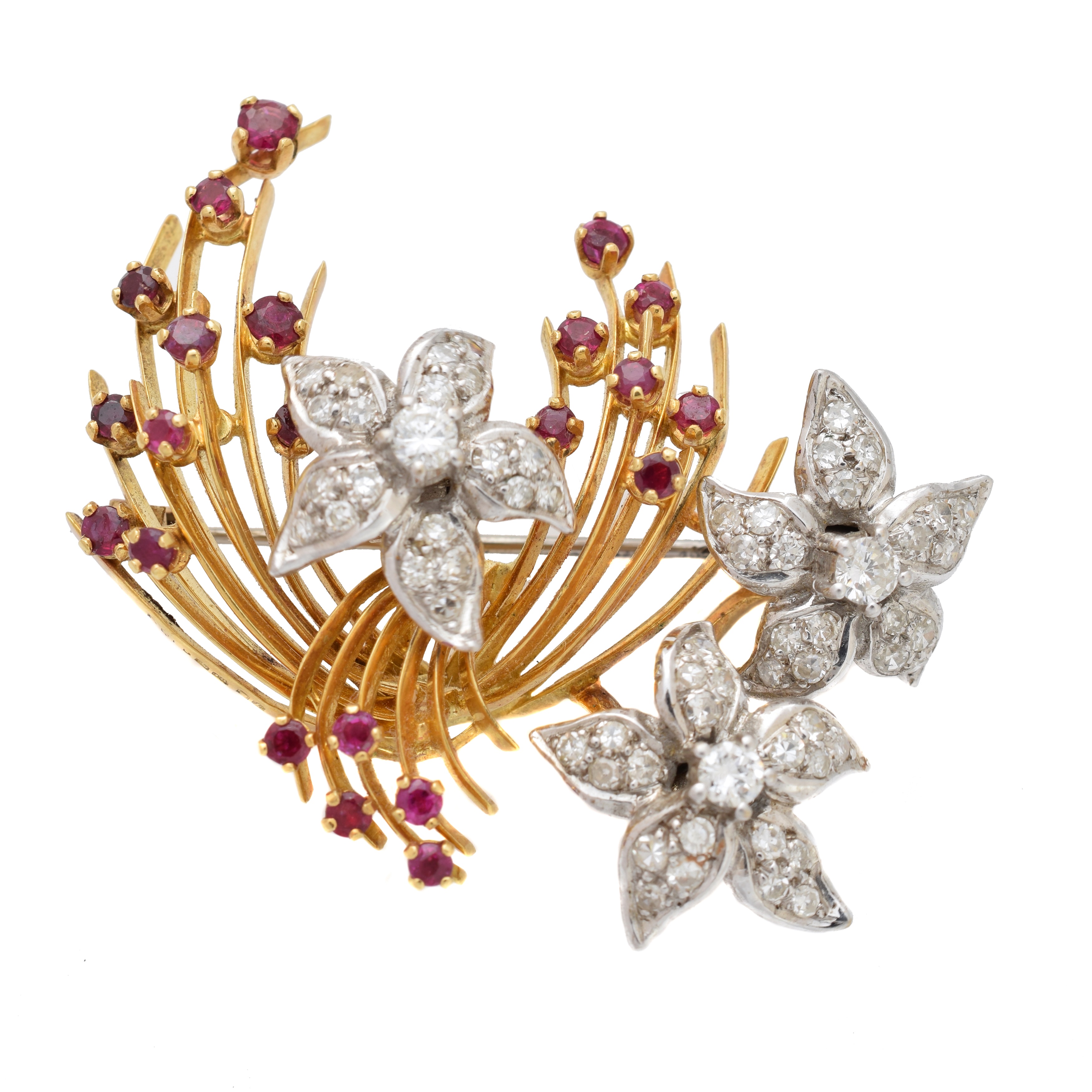 A 1960s 18ct gold diamond and ruby brooch by Ben Rosenfeld, comprising three vari cut diamond clusters, set en tremblant to the vari size circular shape ruby spray, estimated total diamond weight 1.55cts, maker's marks for Ben Rosenfeld, hallmarks for London, 1965, length 4.7cm, gross weight 19.3g.