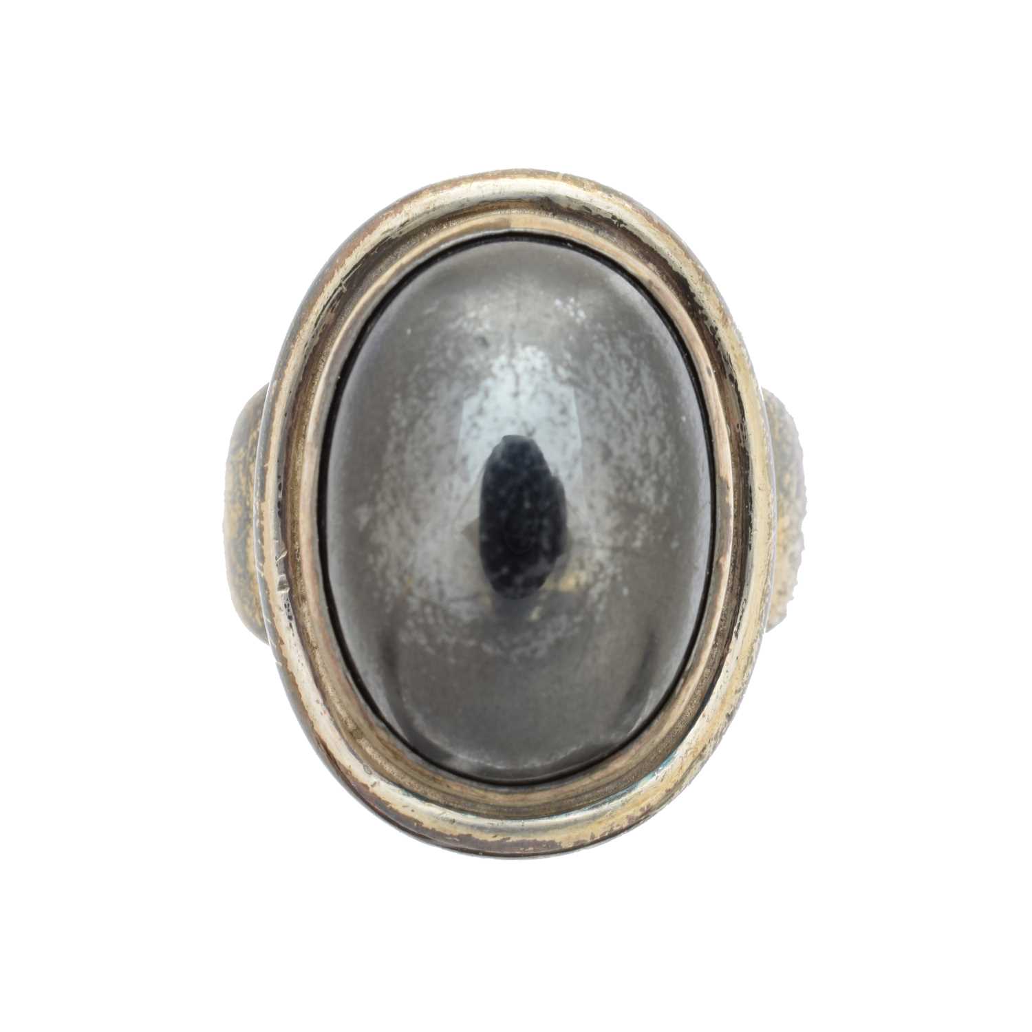 A Georg Jensen ring, no. 46A, the oval haematite cabochon within a grooved surround and tapered shoulders, maker's marks for Georg Jensen, import marks for London, 1962, ring size P, gross weight 12.6g.