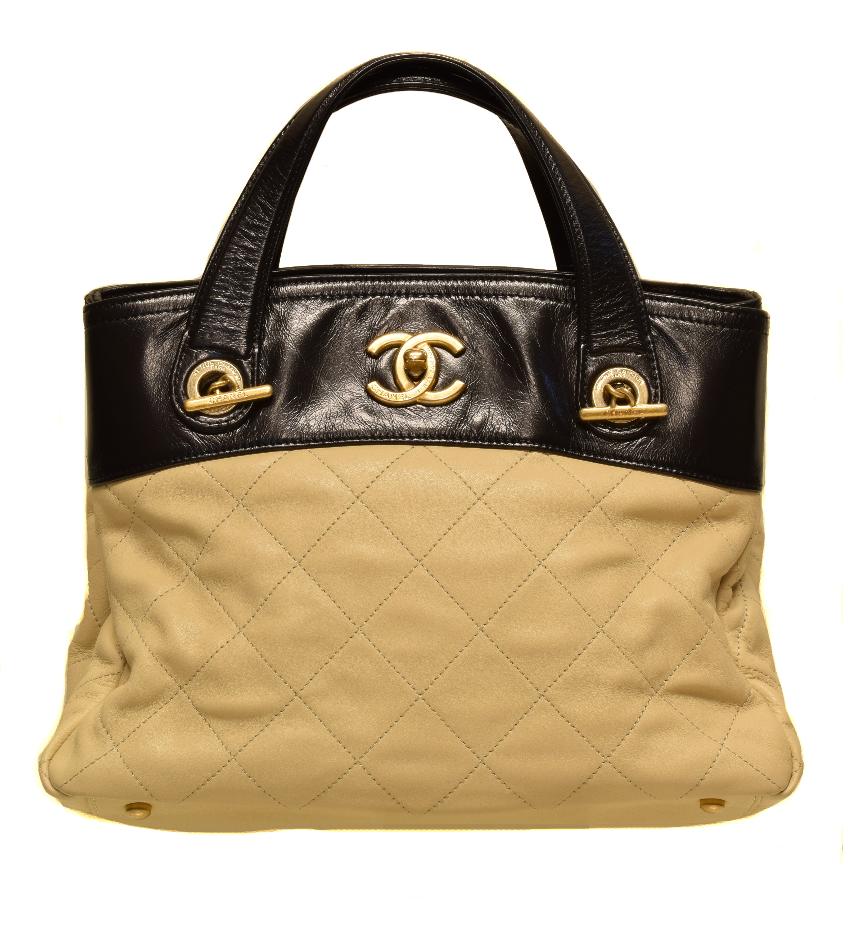 A Chanel In The Mix Shoulder Bag, circa 2012-3, the beige quilted calf leather exterior with smooth black leather detailing, gold tone hardware, interlace chain and black leather strap, serial no. 17422353. With maker's authenticity card and dust bag.