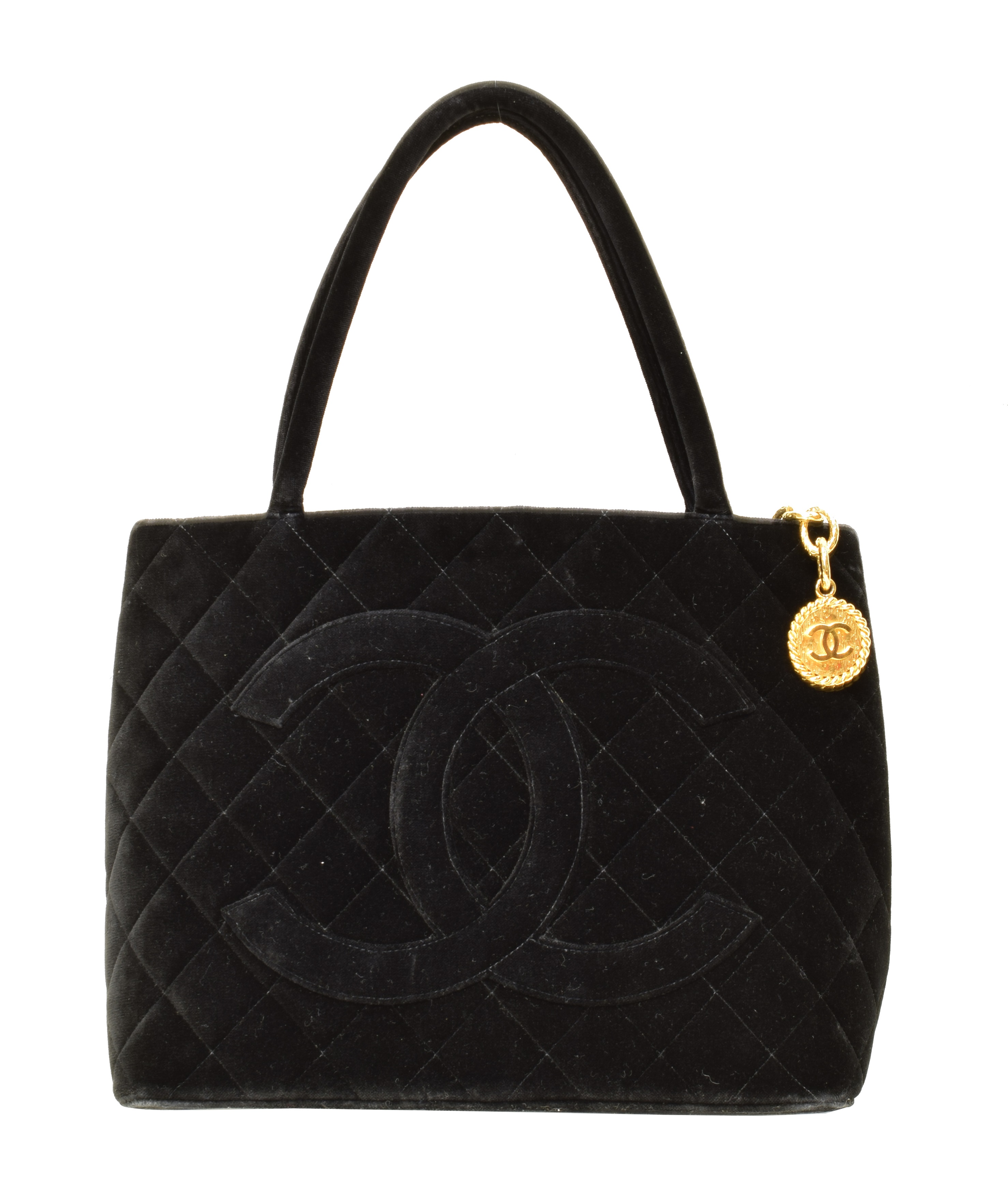 A Chanel Medallion Shoulder Bag, circa 1997-9, the black velvet quilted canvas exterior with black canvas strap and gold tone hardware, serial no. 5411744.