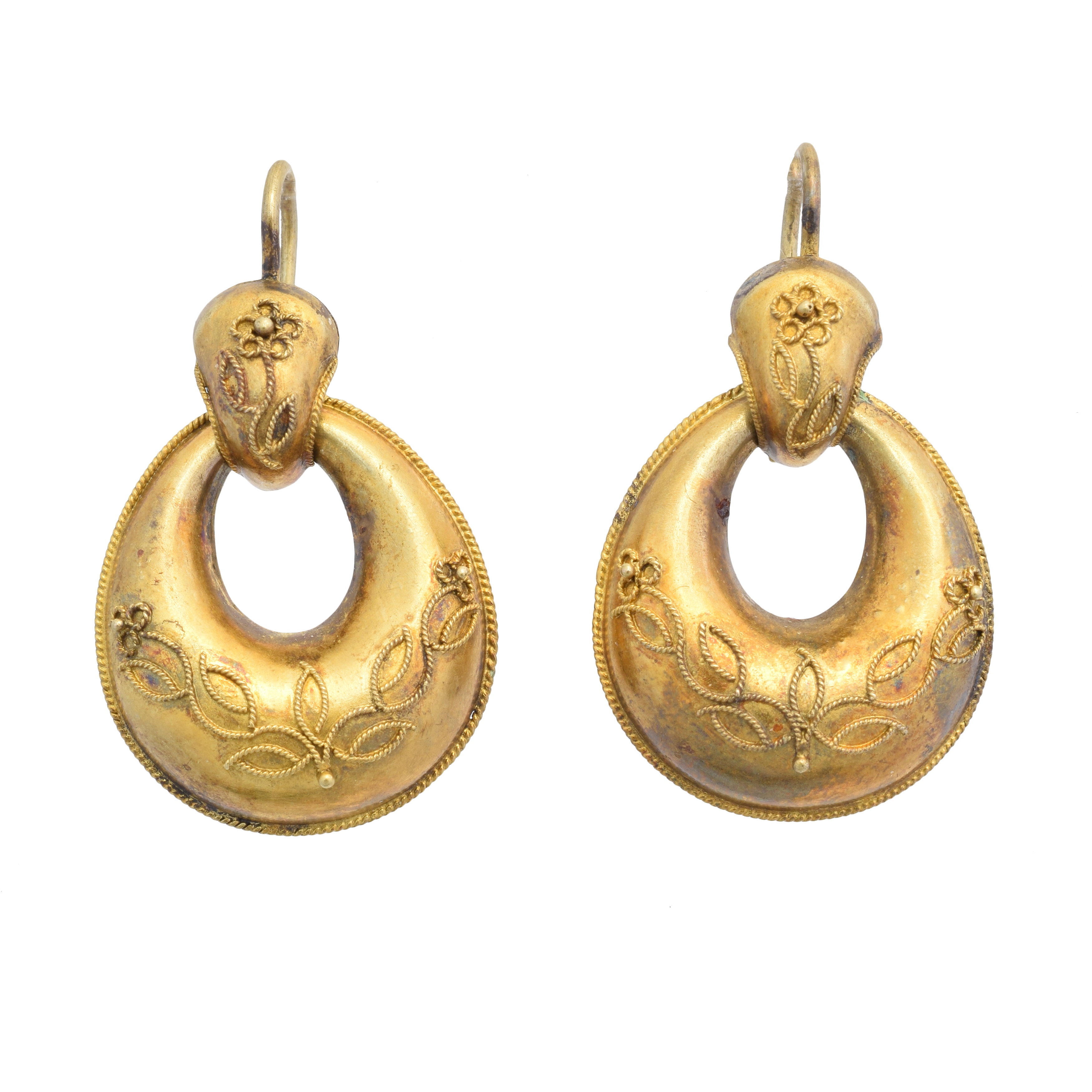 A pair of Victorian drop earrings, each designed as a cannetille hoop suspended from a floral tapered surmount, length 3.4cm, gross weight 3.8g.