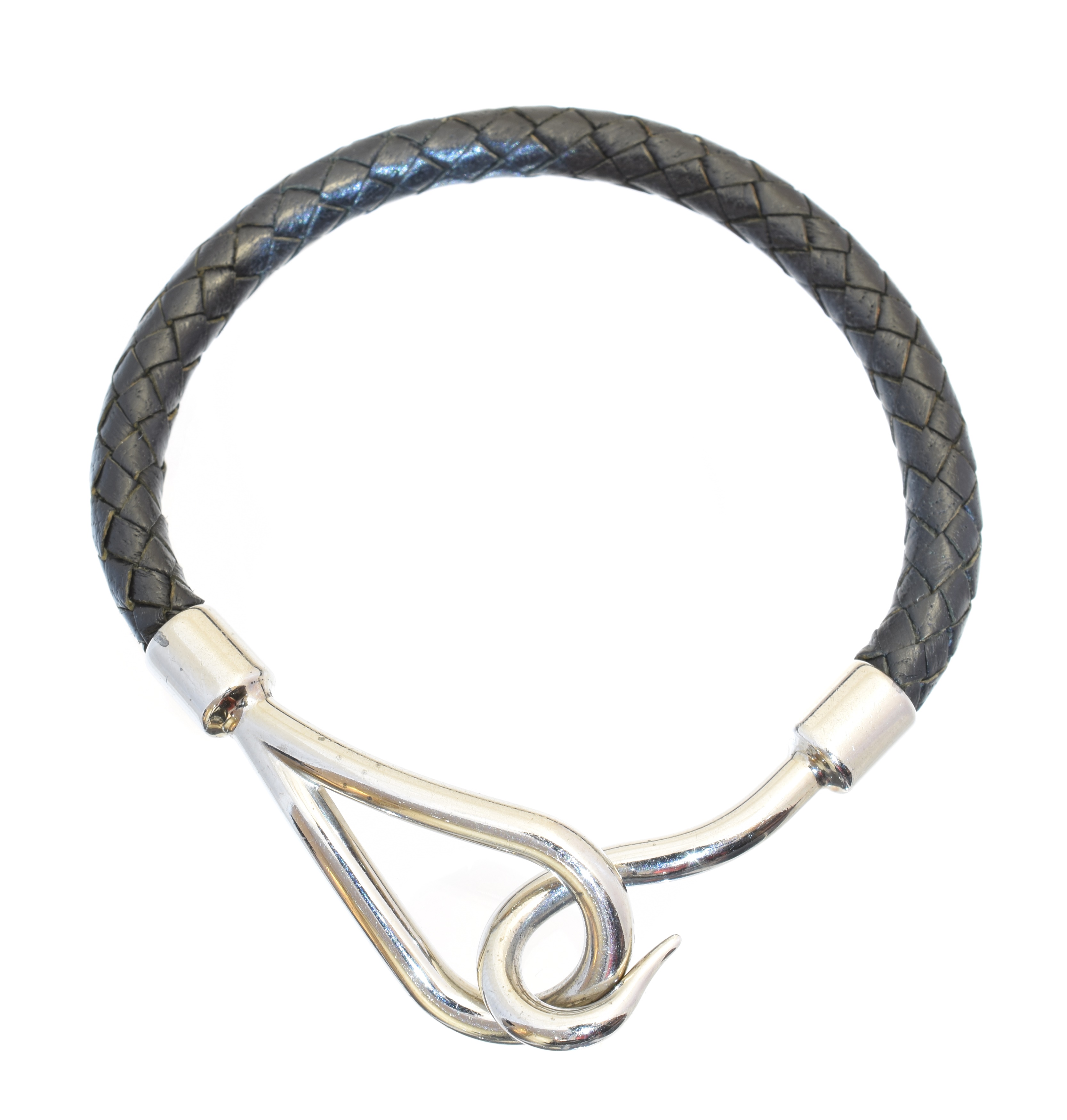 A Hermès Jumbo bracelet, the black swift calfskin braided strap with silver-tone hook fastening, signed Hermès.