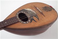 Lot 180 - Bowl back mandolin by Mario Casella, with rosewood back and pearl bird sound hole decoration.