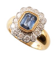 Lot 83 - Sapphire and diamond cushion shaped 18ct gold ring, central rectangular cut cornered blue sapphire weighing approximately 1.50ct, 14 round brilliant cut diamond to surround, weighing a total of app...