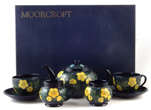 Lot 83 - Moorcroft boxed tea service in buttercup pattern