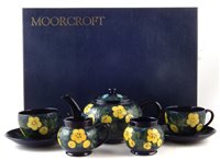 Lot 83 - Moorcroft boxed tea service in buttercup pattern