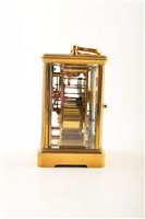 Lot 338 - A 19th century brass carriage clock with original leather carry case.