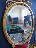 Lot 364 - A pair of Regency Gesso framed oval Girandole wall mirrors.
