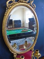 Lot 364 - A pair of Regency Gesso framed oval Girandole wall mirrors.