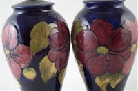 Lot 82 - Pair of Moorcroft vase lamp bases decorated with Clematis pattern