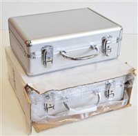 Lot 123 - Two modern aluminium coin cases, with interior trays (2).