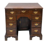 Lot 351 - George III oak knee-hole desk.