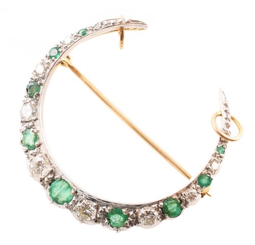 Lot 131 - Emerald and diamond 18ct yellow and white gold crescent brooch