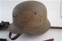 Lot 289 - A collection of items, German type helmet, 22 air rifle, No. 4 bayonet trench art knife, sabre