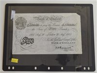 Lot 22 - An album of banknotes to include a Bank of England white Five Pounds note.