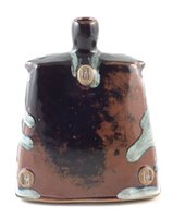 Lot 88 - James Hake, a small stoneware bottle covered in nuka ash and tenmoku glaze.