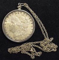 Lot 70 - A Morgan One Dollar, 1896 set in a mount with silver chain.
