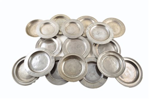 Lot 12 - Eighteen 18th and 19th century pewter side-plates with various unidentified touchmarks, including London touchmarks.