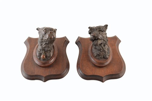 Lot 314 - Two bronze dogs heads of a mastiff and a terrier mounted on oak shields, after Prosper LeCourtier