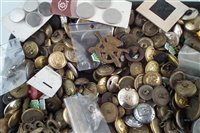 Lot 227 - Large collection of military buttons, badges, and other uniform items, together with a selection of WW2 medals.