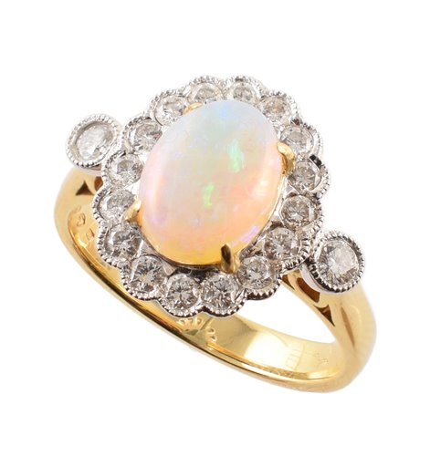 Lot 139 - Opal and diamond oval cluster 18ct gold ring with diamond set shoulders