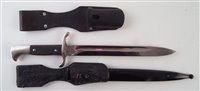 Lot 175 - German WWII Fireman's bayonet with scabbard and frog, also one other frog