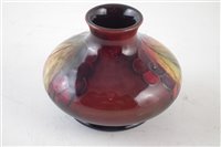 Lot 73 - Moorcroft flambe vase, decorated with leaves and berries pattern