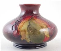 Lot 73 - Moorcroft flambe vase, decorated with leaves and berries pattern