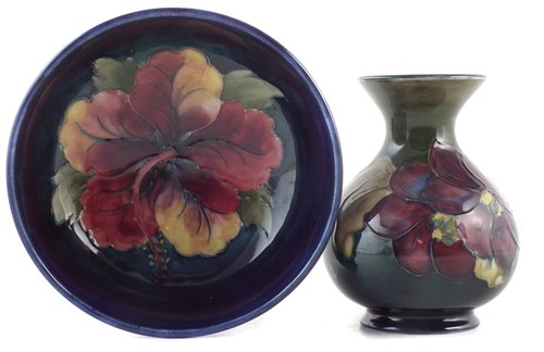 Lot 78 - Moorcroft vase and a bowl, decorated with Hibiscus and Clematis patterns