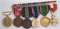 Lot 310 - Legion of frontiersmen medal and five other related medals.