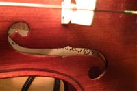 Lot 18 - 19th century violin after Pietro Guarneri together with three bows and a case.