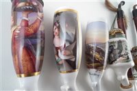 Lot 48 - Four hand painted continental porcelain pipes together with a collection of other continental porcelain pipes