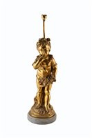Lot 322 - A 19th century bronze figural lamp on a marble base.