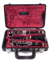 Lot 26 - Yamaha clarinet serial number 009189 with case and related music books.