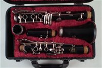 Lot 26 - Yamaha clarinet serial number 009189 with case and related music books.