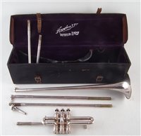 Lot 345 - Hawkes & Son fanfare trumpet or aida, with pipes for keys C, D, Eb with mouth piece and case, serial 43977 157cm max length