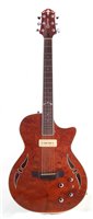 Lot 105 - Crafter SAT Bubinga hybrid guitar with hard case and accessories.