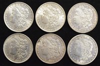 Lot 2 - Six assorted USA silver Morgan Dollars (6).