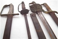 Lot 189 - Three cutlasses or short swords and a court sword