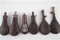 Lot 123 - Four powder flasks and two shot flasks
