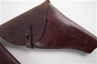 Lot 318 - Two leather revolver holsters