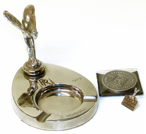 Lot 50 - Rolls Royce ash tray with flying lady and "Strive For Perfection" lapel pin and 64 year medallion