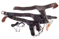Lot 231 - Collection of Cow Boy leather to include three belts and holsters, and a pair of stirrups
