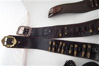 Lot 231 - Collection of Cow Boy leather to include three belts and holsters, and a pair of stirrups