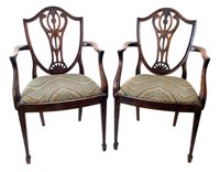 Lot 341 - A pair of George III Hepplewhite style open arm chairs.