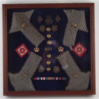 Lot 242 - Cased display containing Duke of Lancaster's cap badges