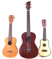 Lot 152 - Three ukuleles