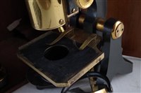 Lot 187 - Swift & Son, Tottenham Court Road, London, lacquered brass and blued steel monocular microscope.