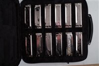 Lot 81 - Cased set of twelve Aria harmonicas together with a Honer Chromonica 260